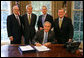 President George W. Bush signs H.R. 2272, The America Competes Act, Thursday, Aug. 9, 2007, in the Oval Office. Pictured with the President are, from left: Director John Marburger of the Office of Science and Technology Policy; Senator Jeff Bingaman of N.M.; Congressman Bart Gordon of Tenn.; and Senator Pete Domenici of N.M. White House photo by Chris Greenberg