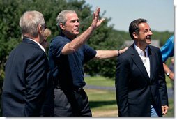 President George W. Bush waves to the press as he welcomes President Nicolas Sarkozy of France to Walker’s Point Saturday, August 11, 2007, in Kennebunkport, Maine. White House photo by Shealah Craighead