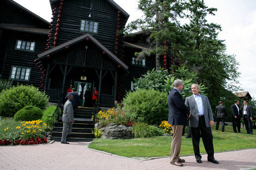 President George W. Bush stands with Canada's Prime Minister Stephen Harper after arriving Monday, Aug. 20, 2007, for their bilateral meeting at the Fairmont Le Chateau Montebello in Montebello, Canada. White House photo by Eric Draper