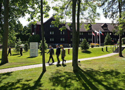 President George W. Bush walks with Canadian Prime Minister Stephen Harper, center, and Mexican President Felipe Calderón Tuesday, Aug. 21, 2007, during the North American Leaders' Summit outside the Fairmont Le Chateau Montebello in Montebello, Canada. White House photo by Eric Draper