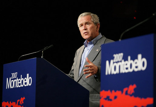 President George W. Bush participates in a joint press conference Tuesday, Aug. 21, 2007, during the North American Leaders' Summit at the Fairmont Le Chateau Montebello in Montebello, Canada. "Since NAFTA came to be, trade between our respective countries has grown from $293 billion a year to $883 billion a year," said the President. White House photo by Eric Draper