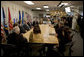 President George W. Bush is joined by Minnesota Governor Tim Pawlenty, U.S. Senator Amy Klobuchar, Minneapolis Mayor R.T. Rybak and other federal, state and local officials, at a briefing Tuesday, Aug. 21, 2007 at the Minneapolis/St. Paul Air Reserve Station, on the recovery efforts at the I-35W bridge collapse site and the flash flooding in southeastern Minnesota. White House photo by Chris Greenberg