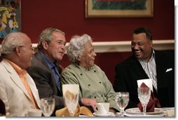 President George W. Bush shares a moment with restaurant owner Leah Chase, center, and fellow dinner guests Dr. Norman Francis, president of Xavier University of Louisiana, left, and Reverend Fred Luter, right, during a dinner with Louisiana cultural and community leaders Tuesday evening, Aug. 28, 2007, at Dooky Chase's restaurant in New Orleans. President Bush and Mrs. Laura Bush are visiting New Orleans and the Gulf Coast region on the second anniversay of Hurricane Katrina. White House photo by Shealah Craighead