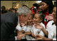 President George W. Bush greets students at the Dr. Martin Luther King Jr. Charter School for Science and Technology Wednesday, Aug. 29, 2007, in New Orleans. White House photo by Chris Greenberg
