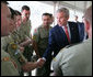 President George W. Bush talks with a member of the Australian Defense Force during a luncheon at the Royal Australia Navy Heritage Centre Wednesday, Sept. 5, 2007, on Garden Island in Sydney Harbour. White House photo by Eric Draper