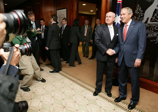 President George W. Bush and Prime Minister John Howard of Australia, shake hands as they meet for the start of a daylong visit Wednesday, Sept. 5, 2007, at the Commonwealth Parliament Offices in Sydney. White House photo by Eric Draper