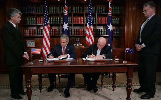 President George W. Bush and Australia's Prime Minister John Howard sign the Defense Cooperation Treaty following a meeting Wednesday, Sept. 5, 2007, at the Commonwealth Parliament Offices in Sydney. White House photo by Eric Draper