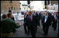 President George W. Bush shakes hands with an unidentified couple Wednesday, Sept. 5, 2007, as he walks to the InterContinental Hotel in Sydney with Prime Minister John Howard of Australia, following their morning meetings. White House photo by Eric Draper