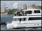 President George W. Bush and Prime Minister John Howard of Australia, wave as they take a tour of Sydney Harbour Wednesday, Sept. 5, 2007. The President is spending the day in meetings with the Prime Minister and will join him later this week at the 2007 APEC summit. White House photo by Chris Greenberg