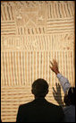 President George W. Bush examines the details of a Yirrkala Bark Painting during a tour Thursday, Sept. 6, 2007, of the Australian National Maritime Museum in Sydney, where the President is scheduled to attend the 2007 APEC summit later this week. White House photo by Eric Draper