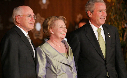 President George W. Bush stands with Prime Minister John Howard of Australia, and his wife, Janette Howard, after arriving at the Sydney Opera House Saturday, Sept. 8, 2007, for the APEC dinner. White House photo by Chris Greenberg