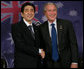 President George W. Bush and Prime Minister Shinzo Abe of Japan, shake hands following their meeting Saturday, Sept. 8, 2007, in Sydney. The President thanked the Prime Minister for his support in the war on terrorism, saying, "The fact that we’re in a war against extremists was heightened today by the release of a tape. The tape is a reminder about the dangerous world in which we live, and it is a reminder that we must work together to protect our people against these extremists." White House photo by Eric Draper