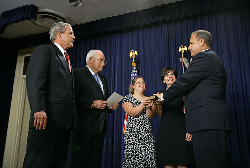 President George W. Bush watches as Vice President Dick Cheney swears in Jim Nussle as the Director of the Office of Management and Budget in the Dwight D. Eisenhower Executive Office Building Monday, Sept. 10, 2007. Pictured holding the bible is Director Nussle's daughter Sarah and his wife Karen Nussle. White House photo by Chris Greenberg