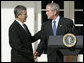 President George W. Bush shakes the hand of Mike Johanns, resigning Secretary of Agriculture, after he announced the secretary's decision to return to his home state of Nebraska during a morning statement in the Rose Garden. White House photo by Joyce N. Boghosian
