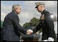 President George W. Bush and outgoing Joint Chiefs of Staff Chairman U.S. Marine General Peter Pace shake hands during the Armed Forces farewell tribute in honor of General Pace and the Armed Forces hail in honor of the new Joint Chiefs of Staff Chairman Navy Admiral Michael Mullen, Monday, October 1, 2007 at Fort Myer, Virginia. General Pace is retiring after serving two years as chairman and 40 years in the U.S. Marines. White House photo by Eric Draper