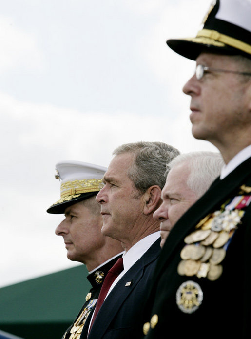 President George W. Bush attends an Armed Forces farewell tribute in honor of U.S. Marine General Peter Pace, left, and Armed Forces hail in honor of Navy Admiral Michael Mullen, right, joined by Secretary of Defense Robert Gates, Monday, October 1, 2007 at Fort Myer, Va. General Pace is retiring after serving two years as Chairman and four years as Vice Chairman of the Joint Chiefs of Staff. White House photo by Eric Draper