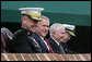 President George W. Bush attends an Armed Forces farewell tribute in honor of Marine General Peter Pace, left, and Armed Forces hail in honor of Navy Admiral Michael Mullen, far right, joined by Secretary of Defense Robert Gates, Monday, October 1, 2007 at Fort Myer, Virginia. General Pace is retiring after serving two years as Chairman and four years as Vice Chairman of the Joint Chiefs of Staff. White House photo by David Bohrer