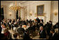 President George W. Bush welcomes guests to the Iftaar Dinner with Ambassadors and Muslim leaders in the State Dining Room of the White House, Thursday, Oct. 4, 2007. White House photo by Chris Greenberg