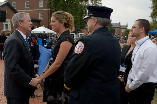 President George Bush greets and offers comfort to friends and family members of firefighters who lost their lives in the line of duty, during a ceremony at the National Fallen Firefighters Memorial in Emmitsburg, Md., Sunday, Oct. 7, 2007. White House photo by Chris Greenberg