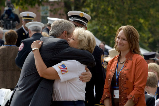 President George Bush greets and offers comfort to friends and family of fallen firefighters during a ceremony at the National Fallen Firefighters Memorial in Emmitsburg, Md., Sunday, Oct. 7, 2007. White House photo by Chris Greenberg
