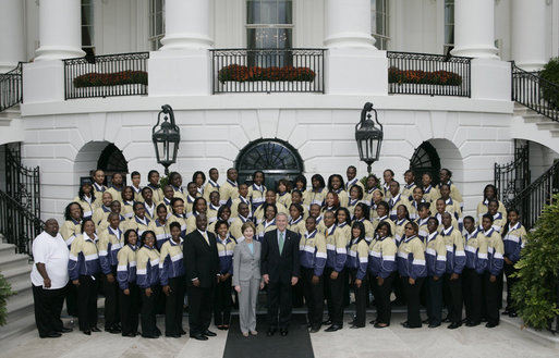 President George W. Bush and Mrs. Laura Bush join members of the Ballou High School Marching Band of Washington, D.C., for a photo on the South Portico of the White House Thursday, Oct. 11, 2007, prior to a screening of Ballou: A Documentary Film, about the band’s inspiring accomplishments for the students and the school. White House photo by Shealah Craighead