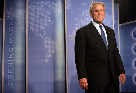 President George W. Bush stands on stage at the Radisson Miami Hotel Friday, Oct. 12, 2007, in Miami, where he delivered remarks on trade policy. Speaking on free trade in the Americas, the President said, "It's in the interests of the United States that prosperity spread through Latin America and South America." White House photo by Eric Draper