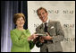 Mrs. Laura Bush is presented with The National Italian American Foundation’s Special Achievement Award in Literacy from NIAF Chairman Dr. Ken Ciongoli, Friday, Oct. 12, 2007, in Washington, D.C. White House photo by Shealah Craighead