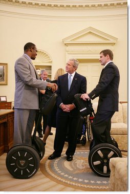 President George W. Bush talks with wounded veterans Sgt.Kortney Clemons, left, of Little Rock, Miss., and Sgt. Ryan Groves of Kent, Ohio, who both use a Segway as a mobility device, on a visit to the Oval office Tuesday, Oct. 16, 2007, attending a meeting of the President's Commission on Care for America's Returning Wounded Warriors. White House photo by Eric Draper