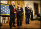 President George W. Bush leads the applause after presenting Dan and Maureen Murphy with the Medal of Honor in honor of their son, Navy Lt. Michael P. Murphy, who died in action during service in support of Operation Enduring Freedom in 2005. White House photo by David Bohrer
