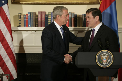 President George W. Bush shakes hands with President Nambaryn Enkhbayar of Mongolia, Monday, Oct. 22, 2007, in the Roosevelt Room of the White House, where the two leaders signed the Millennium Challenge Corporation Compact. Said President Bush: "The Millennium Challenge Compact encourages countries to make a firm commitment to basic principles, principles that mean the government will listen to their people and respond to the needs of the people.We honor the success of your country and the commitment of your government to basic principles." White House photo by Eric Draper