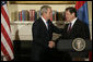 President George W. Bush shakes hands with President Nambaryn Enkhbayar of Mongolia, Monday, Oct. 22, 2007, in the Roosevelt Room of the White House, where the two leaders signed the Millennium Challenge Corporation Compact. Said President Bush: "The Millennium Challenge Compact encourages countries to make a firm commitment to basic principles, principles that mean the government will listen to their people and respond to the needs of the people.We honor the success of your country and the commitment of your government to basic principles." White House photo by Eric Draper