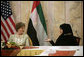 Mrs. Laura Bush talks with Basmah Zeyoudi during a roundtable discussion with young Arab women leaders Monday, Oct. 22, 2007, in Abu Dhabi, United Arab Emirates. Moderating the discussion is U.S. Ambassador Michele Sison. White House photo by Shealah Craighead
