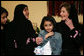 Mrs. Laura Bush talks with Dr. Samia Al-Amoudi, a breast cancer survivor, during a “Breaking the Silence” Coffee Wednesday, Oct. 24, 2007, in Jeddah, Saudi Arabia. Mrs. Bush met with breast cancer survivors and members of their families to discuss awareness issues. Pictured at left is Dr. Samia’s daughter, Esraa Al-Harbi, 10-year-old author of a children's book entitled, “My Mother and Breast Cancer.” The child at center is unidentified. White House photo by Shealah Craighead