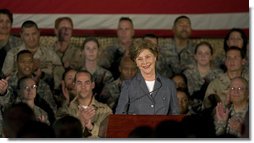 Mrs. Laura Bush addresses American troops Thursday, Oct. 25, 2007, at Ali Al Salem Air Base near Kuwait City. "With your courage and compassion, you show that the United States military is one of the greatest forces for good in the world," Mrs. Bush told the troops. "And I hope you know that we pray. for an end to the violence everywhere so that future generations can grow up in a world at peace -- a world that you shaped."  White House photo by Lynden Steele