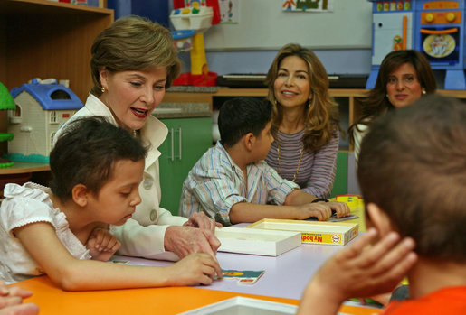 Mrs. Laura Bush helps Balkes Nafe put together a puzzle during a visit with young patients in the Children's Playroom at the King Hussein Cancer Center Thursday, Oct. 25, 2007, in Amman, Jordan. Also pictured are Her Royal Highness Princess Ghida Talal, left, and Her Royal Highness Princess Dina Mired bin Ra'ad. White House photo by Shealah Craighead