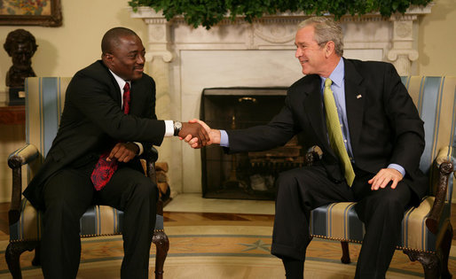 President George W. Bush welcomes President Joseph Kabila of the Democratic Republic of Congo to the Oval Office Friday, Oct. 26, 2007. Among the topics the leaders discussed during the visit were the successes of the newly elected Kabila government and the remaining challenges to a secure and prosperous Congo. White House photo by Eric Draper