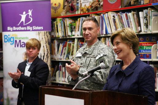 Mrs. Laura Bush is applauded during her address to students, faculty and guests at the Good Shepherd Nativity Mission School, Thursday, Nov. 1, 2007 in New Orleans, during a Helping America's Youth visit with Big Brother and Big Sisters of Southeast Louisiana. Mrs. Bush spoke about the importance of adults as positive role models in young children's lives. Student Taylor McIntyre is seen at left, joined by his Big Brother Captain Richard T. Douget. White House photo by Shealah Craighead