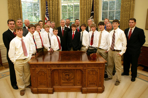 President George W. Bush stands with members of the Warner Robins, Georgia Little League team, champions of the 2007 Little League World Series, Thursday, Nov. 1, 2007, in the Oval Office of the White House. The Southeast Champs defeated the Tokyo Kitasuna Little Leaguers 3-2 in the championship game in August in Williamsport, Pa. White House photo by Eric Draper