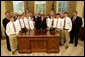 President George W. Bush stands with members of the Warner Robins, Georgia Little League team, champions of the 2007 Little League World Series, Thursday, Nov. 1, 2007, in the Oval Office of the White House. The Southeast Champs defeated the Tokyo Kitasuna Little Leaguers 3-2 in the championship game in August in Williamsport, Pa. White House photo by Eric Draper