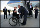 President George W. Bush greets Marine Corps Lt. Andrew Kinard, a 24-year-old from Spartanburg, S.C., after arriving Friday, Nov. 2, 2007, at Columbia Metropolitan Airport in Columbia, S.C. The Marine was wounded in 2006 while serving in Iraq. White House photo by Eric Draper