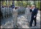President George W. Bush salutes as he acknowledges members of the 260th Brigade during his visit to Fort Jackson in Columbia, S.C. Fort Jackson is the largest and most active Initial Entry Training Center in the U.S. Army, training more than 50 percent of all soldiers enter the Army each year. With him is Brig. Gen James Schwitter, Commanding General of the base. White House photo by Eric Draper