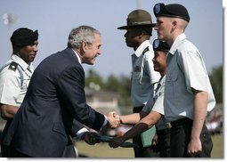 President George W. Bush shakes hands with recipients of outstanding soldier awards during the Basic Combat Training Graduation Ceremonies Friday, Nov. 2, 2007, at Fort Jackson in Columbia, S.C. Fort Jackson is the largest and most active Initial Training Center in the U.S. Army, training an average of 50,000 soldiers per year. White House photo by Eric Draper