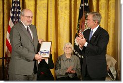 Robert Hyde accepts the Presidential Medal of Freedom from President George W. Bush on behalf of his father U.S. Representative Henry Hyde, R-Ill., during a ceremony Monday, Nov. 5, 2007, in the East Room. "Colleagues were struck by his extraordinary intellect, his deep convictions, and eloquent voice," said the President. "In committee and in the House chamber, the background noise would stop when Henry Hyde had the floor."  White House photo by Eric Draper