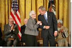 President George W. Bush awards the Presidential Medal of Freedom to author Harper Lee during a ceremony Monday, Nov. 5, 2007, in the East Room. "To Kill a Mockingbird has influenced the character of our country for the better. It's been a gift to the entire world. As a model of good writing and humane sensibility, this book will be read and studied forever," said the President about Harper Lee's work. White House photo by Eric Draper