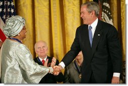 President George W. Bush awards the Presidential Medal of Freedom to Liberian President Ellen Johnson Sirleaf during a ceremony Monday, Nov. 5, 2007, in the East Room. "When free elections returned to Liberia, the voters made history," said President Bush. "They chose her to be the first woman ever elected to lead a nation on the continent of Africa."  White House photo by Eric Draper