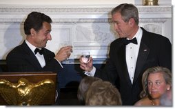 President George W. Bush and President Nicolas Sarkozy of France raise their glasses in toast Tuesday, Nov. 6, 2007, during dinner in the State Dining Room in the honor of the French leader. White House photo by Chris Greenberg