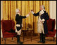 General George Washington (played by Dean Malissa) and General Marie Joseph Paul Yves Roch Gilbert du Motier, the Marquis de LaFayette (played by Benjamin Goldman), toast each other at the beginning of their dialogue Tuesday, Nov. 6, 2007, during the entertainment in the East Room following a dinner in honor of President Nicolas Sarkozy at the White House. White House photo by Chris Greenberg