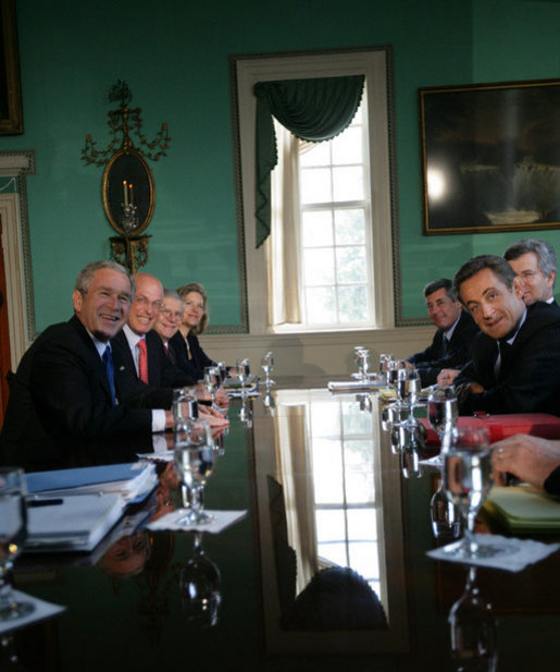 President George W. Bush and President Nicolas Sarkozy of France pause for cameras as they meet in the Large Dining Room at the Mount Vernon Estate in Mount Vernon, Va., Wednesday, Nov. 7, 2007. White House photo by Eric Draper