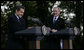 President George W. Bush shares a laugh with President Nicolas Sarkozy of France as they participate in a joint press availability Wednesday, Nov. 7, 2007, at Mount Vernon, Va. White House photo by Eric Draper