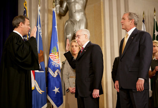 President George W. Bush attends the swearing in of Attorney General Michael Mukasey Wednesday, Nov. 14, 2007, at the U.S. Department of Justice in Washington, D.C. Chief Justice of the United States John Roberts conducted the ceremony."The Attorney General must run the world's largest law firm, and the central agency for enforcement of our federal laws," said President Bush. "He must aggressively prosecute gun criminals and drug dealers, hold corporate wrongdoers to account, protect victims of child abuse and domestic violence, and uphold the civil rights of every American." White House photo by Eric Draper